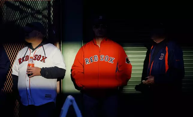 FILE-Fans arrive at Fenway Park in this Oct. 19, 2021, file photo in Boston.(AP Photo/Robert F. Bukaty, files)