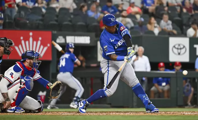Kansas City Royals designated hitter Salvador Perez grounds out in the fourth inning as Texas Rangers catcher Jonah Hiem watches during a baseball game, Thursday, June 19, 2025, Arlington, Texas. (AP Photo/Albert Pena)