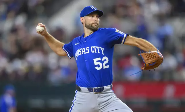 Kansas City Royals pitcher Michael Wacha pitches in the first inning of a baseball game against the Texas Rangers, Thursday, June 19, 2025, Arlington, Texas. (AP Photo/Albert Pena)