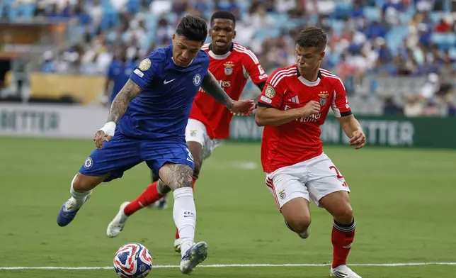 Chelsea's Enzo Fernandez, left, and Benfica's Samuel Dahl battle for the ball during the Club World Cup round of 16 soccer match between Benfica and Chelsea in Charlotte, N.C., Saturday, June 28, 2025. (AP Photo/Nell Redmond)