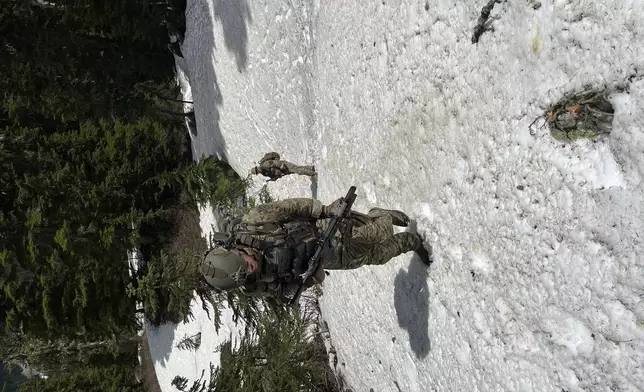 In this handout photo provided by the Snohomish County Sheriff's Office deputies participate in the search for Travis Decker, at an undisclosed location in Washington state, Friday, June 6, 2025. (Snohomish County Sheriff's Office photo via AP)