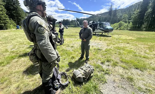 In this handout photo provided by the Snohomish County Sheriff's Office deputies participate in the search for Travis Decker, at an undisclosed location in Washington state, Friday, June 6, 2025. (Snohomish County Sheriff's Office photo via AP)