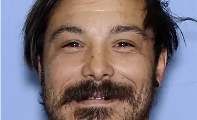 This undated photo provided by the Wenatchee Police Department shows Travis Caleb Decker who the police are asking the public for help in locating the Washington state father who is wanted for murder after his three young daughters were reported missing and then found dead. (Wenatchee Police Department via AP)