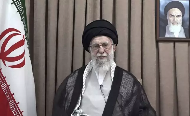 This photo released on Wednesday, June 18, 2025, by the official website of the office of the Iranian supreme leader, shows Supreme Leader Ayatollah Ali Khamenei in a televised speech, under a portrait of the late revolutionary founder Ayatollah Khomeini. (Office of the Iranian Supreme Leader via AP)