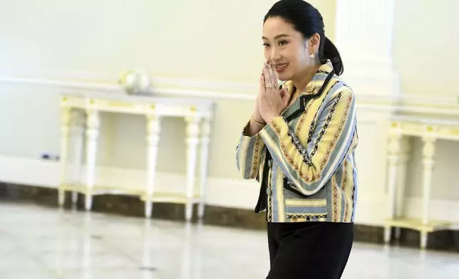 In this photo released by Thailand's Government Spokesman Office, Thailand's Prime Minister Paetongtarn Shinawatra arrives at Government house in Bangkok, Thailand, Monday, June 23, 2025. (Thailand's Government Spokesman Office via AP)