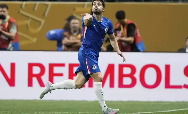 Chelsea's Pedro Neto blows a kiss as he celebrates after scoring the opening goal against Los Angeles FC during the Club World Cup group D soccer match between Chelsea and Los Angeles FC in Atlanta, Monday, June 16, 2025. (AP Photo/Brynn Anderson)