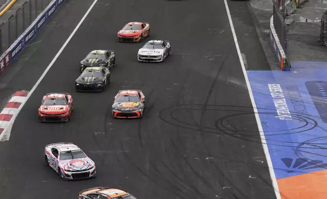 Cole Custer (41) leads the pack during a NASCAR Cup Series auto race at Hermanos Rodríguez race track in Mexico City, Sunday, June 15, 2025. (AP Photo/Marco Ugarte)