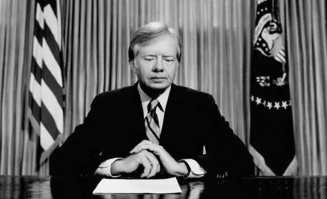 FILE - President Jimmy Carter prepares to make a national television address from the Oval Office at the White House, April 25, 1980, in Washington, on the failed mission to rescue the Iran hostages. (AP Photo, File)