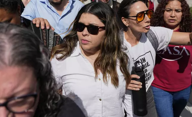 Jennifer Vasquez Sura, center left, wife of Kilmar Abrego Garcia leaves the federal courthouse Wednesday, June 25, 2025, in Nashville, Tenn. (AP Photo/George Walker IV)