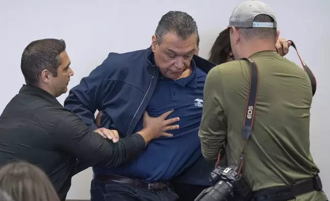 U.S. Sen. Alex Padilla, D-Calif., is pushed out of the room as Homeland Security Secretary Kristi Noem holds a news conference regarding the recent protests in Los Angeles, Thursday, June 12, 2025. (David Crane/The Orange County Register via AP)