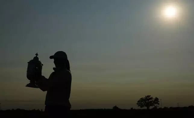 Maja Stark, of Sweden, holds her winning trophy after winning the U.S. Women's Open golf tournament at Erin Hills Sunday, June 1, 2025, in Erin, Wis. (AP Photo/Matt York)