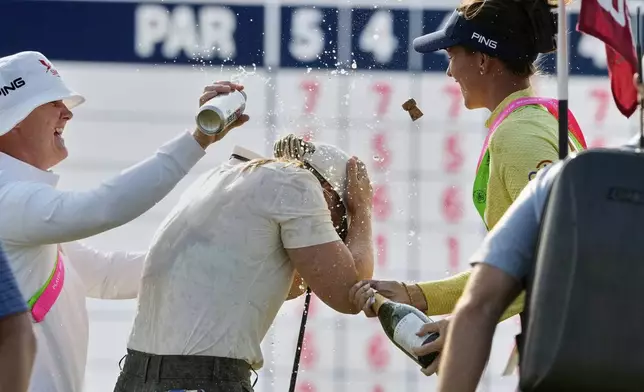 Maja Stark, of Sweden, celebrates with Linn Grant, of Sweden, after winning the U.S. Women's Open golf tournament at Erin Hills Sunday, June 1, 2025, in Erin, Wis. (AP Photo/Matt York)