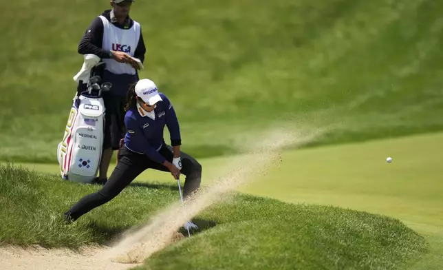 A Lim Kim, of South Korea, hits from the bunker on the fifth hole during the third round of the U.S. Women's Open golf tournament at Erin Hills Saturday, May 31, 2025, in Erin, Wis. (AP Photo/Jeff Roberson)