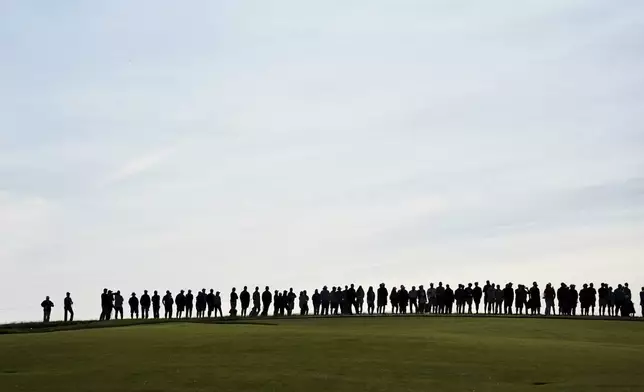 Spectators line up along the 10th fairway during the second round of the U.S. Women's Open golf tournament at Erin Hills Friday, May 30, 2025, in Erin, Wis. (AP Photo/Jeff Roberson)