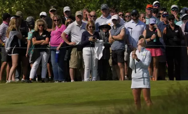 Sarah Schmelzel reacts after her bogie on the 13th hole during the third round of the U.S. Women's Open golf tournament at Erin Hills Saturday, May 31, 2025, in Erin, Wis. (AP Photo/Matt York)