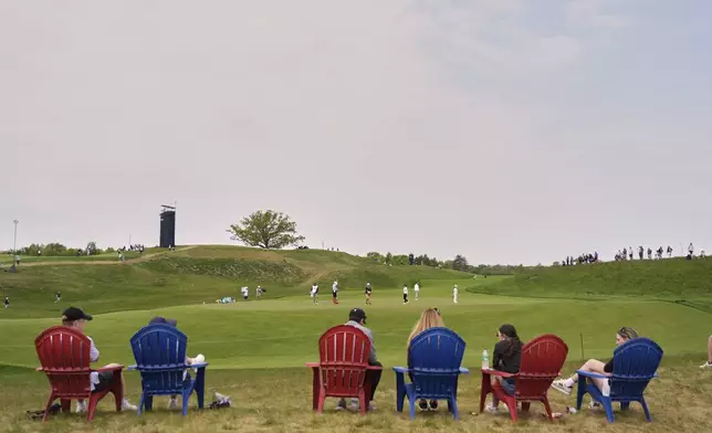 Fans watch the 17th green during the second round of the U.S. Women's Open golf tournament at Erin Hills Friday, May 30, 2025, in Erin, Wis. (AP Photo/Jeff Roberson)