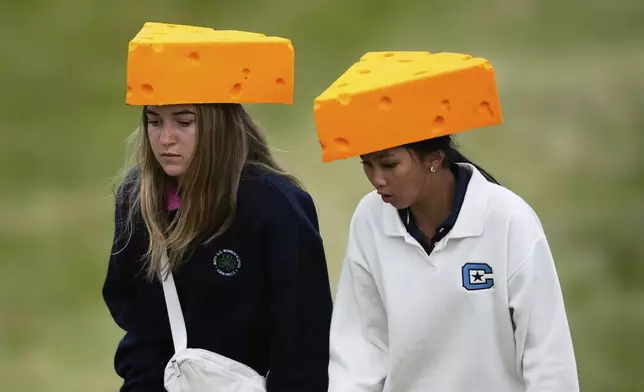 Fans wear cheeseheads on the eighth hole during the second round of the U.S. Women's Open golf tournament at Erin Hills Friday, May 30, 2025, in Erin, Wis. (AP Photo/Matt York)