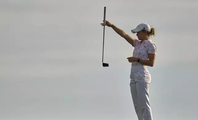 Chiara Tamburlini, of Switzerland, lines up a putt on the seventh hole during the first round of the U.S. Women's Open golf tournament at Erin Hills Thursday, May 29, 2025, in Erin, Wis. (AP Photo/Jeff Roberson)