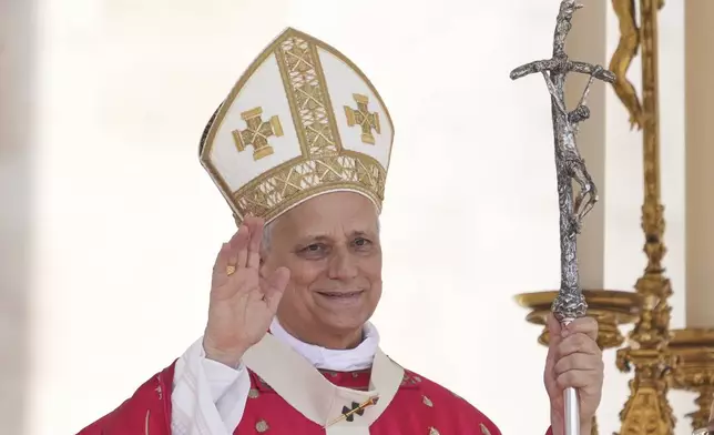 Pope Leo XIV waves at the end of a Mass for the Jubilee of New Religious Associations on Pentecost Day in St. Peter's Square at the Vatican, Sunday, June 8, 2025. (AP Photo/Andrew Medichini)