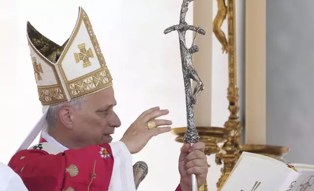 Pope Leo XIV delivers his blessing at the end of a Mass for the Jubilee of New Religious Associations on Pentecost Day in St. Peter's Square at the Vatican, Sunday, June 8, 2025. (AP Photo/Andrew Medichini)