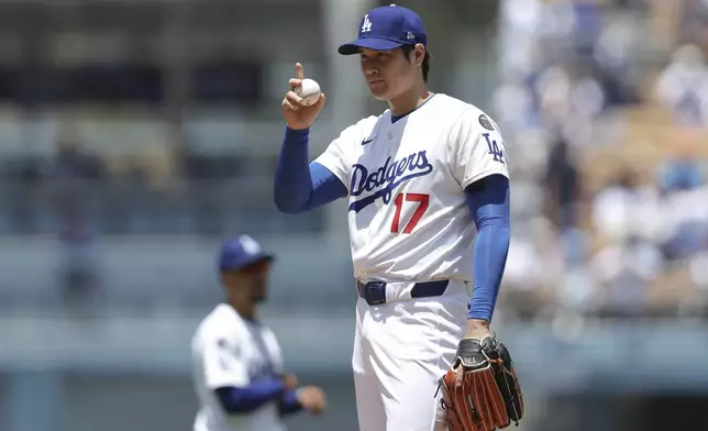 Los Angeles Dodgers starting pitcher Shohei Ohtani gestures before a baseball game against the Washington Nationals in Los Angeles, Sunday, June 22, 2025. (AP Photo/Jessie Alcheh)