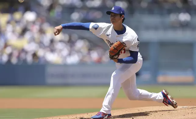 Los Angeles Dodgers starting pitcher Shohei Ohtani throws to a Washington Nationals batter during the first inning of a baseball game in Los Angeles, Sunday, June 22, 2025. (AP Photo/Jessie Alcheh)