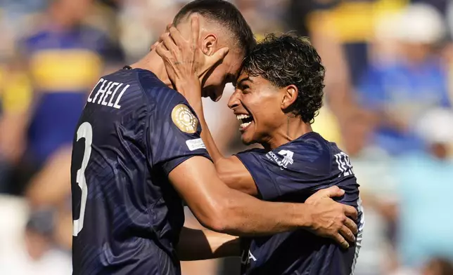 Auckland City's Adam Mitchell, left, and Jerson Lagos celebrate after the Club World Cup Group C soccer match between Auckland City and Boca Juniors in Nashville, Tenn., Tuesday, June 24, 2025. (AP Photo/George Walker IV)