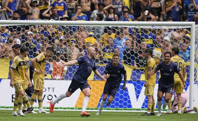 Auckland City's Christian Gray, center left, celebrates after scoring his side's opening goal during the Club World Cup Group C soccer match between Auckland City and Boca Juniors in Nashville, Tenn., Tuesday, June 24, 2025. (AP Photo/George Walker IV)