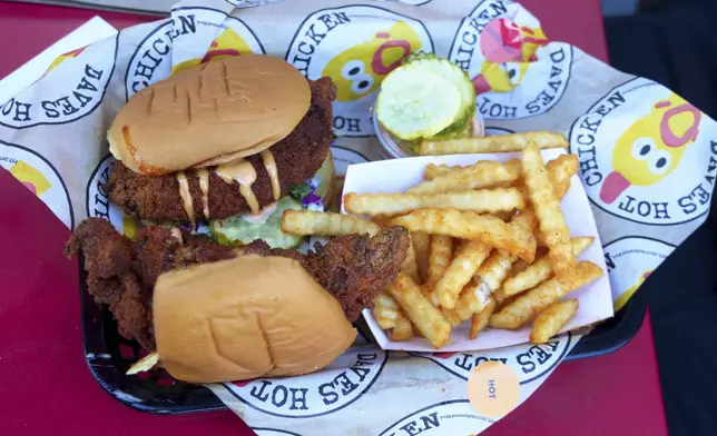 Dave's Hot Chicken food is seen at the restaurant in the Little Tokyo district of Los Angeles Monday, June 2, 2025. (AP Photo/Damian Dovarganes)
