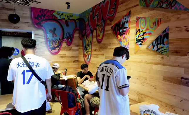 The Dave's Hot Chicken restaurant is seen in the Little Tokyo district of Los Angeles Monday, June 2, 2025. (AP Photo/Damian Dovarganes)