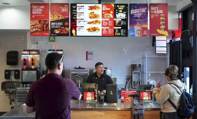 The Dave's Hot Chicken restaurant is seen in the Little Tokyo district of Los Angeles Monday, June 2, 2025. (AP Photo/Damian Dovarganes)