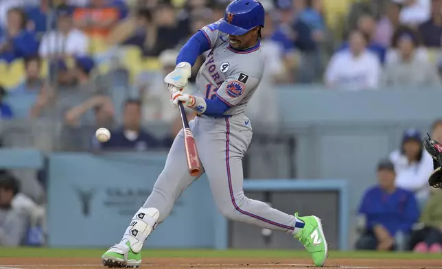 New York Mets' Francisco Lindor hits a solo home run in the first inning of a baseball game against the Los Angeles Dodgers, Monday, June 2, 2025, in Los Angeles. (AP Photo/Jayne Kamin-Oncea)