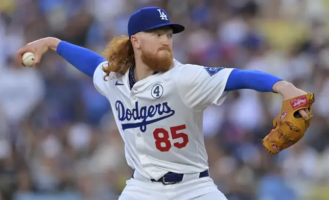 Los Angeles Dodgers starting pitcher Dustin May delivers to the plate during the first inning of a baseball game against the New York Mets, Monday, June 2, 2025, in Los Angeles. (AP Photo/Jayne Kamin-Oncea)