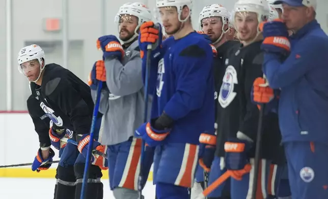 Edmonton Oilers defenceman Darnell Nurse, left, looks up ice during practice at the NHL Stanley Cup Finals in Fort Lauderdale, Fla., Tuesday, June 10, 2025.(Nathan Denette/The Canadian Press via AP)