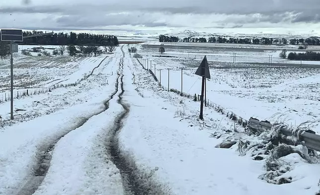 Snow covers the N2 road heading to Nolangeni, South Africa, Tuesday, June 10, 2025. (Greater Kokstad Municipality via AP)