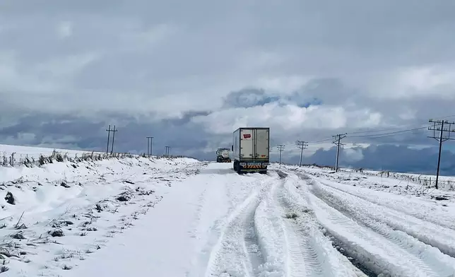 Snow covers the N2 road heading to Nolangeni, South Africa, Tuesday, June 10, 2025. (Greater Kokstad Municipality via AP)