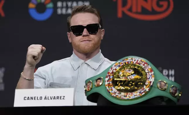 Canelo Alvarez motions during a news conference Friday, June 27, 2025, in Las Vegas. (AP Photo/John Locher)