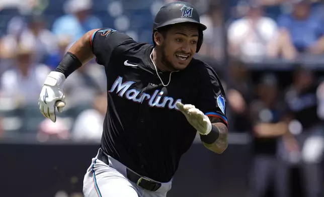 Miami Marlins' Dane Myers doubles off Tampa Bay Rays pitcher Zack Littell during the third inning of a baseball game Friday, June 6, 2025, in Tampa, Fla. (AP Photo/Chris O'Meara)