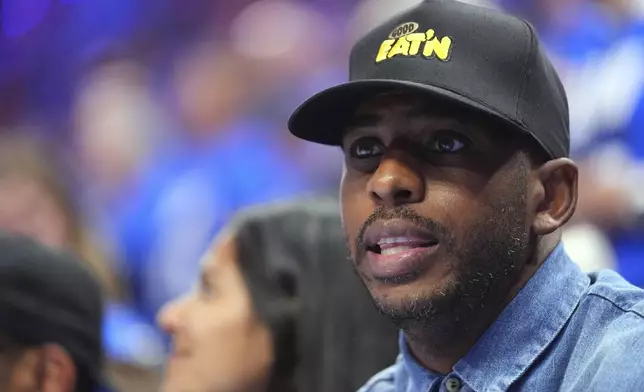 Chris Paul watches the first half of Game 2 of the NBA Finals basketball series between the Indiana Pacers and theOklahoma City Thunder Sunday, June 8, 2025, in Oklahoma City. (AP Photo/Julio Cortez)