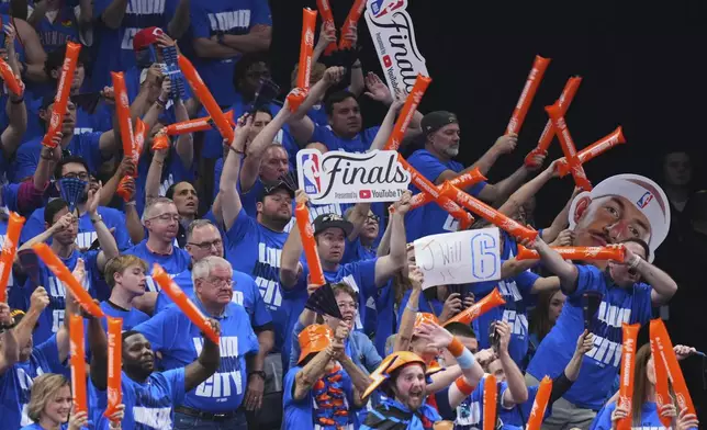 Oklahoma City Thunder fans cheer during the second half of Game 2 of the NBA Finals basketball series against the Indiana Pacers Sunday, June 8, 2025, in Oklahoma City. (AP Photo/Kyle Phillips)
