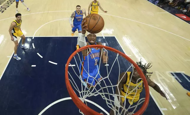 Oklahoma City Thunder forward Jalen Williams (8) shoots over Indiana Pacers forward Aaron Nesmith (23) during the first half of Game 3 of the NBA Finals basketball series, Wednesday, June 11, 2025, in Indianapolis. (AP Photo/Abbie Parr)