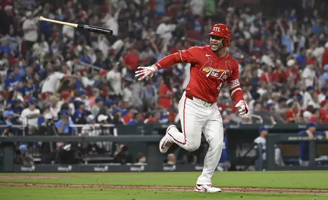 St. Louis Cardinals' Willson Contreras tosses his bat after hitting a solo home run in the eighth inning of a baseball game against the Los Angeles Dodgers, Friday, June 6, 2025, in St. Louis. (AP Photo/Joe Puetz)