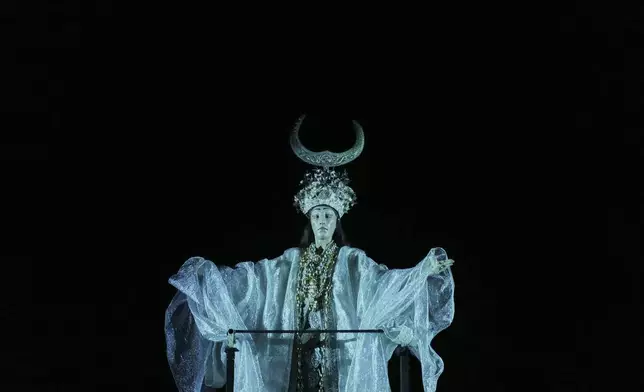 Performer Denia Mimerini of the Greek National Opera plays at Giacomo Puccini's "Turandot" during the 70th Athens Epidaurus Festival at the Odeon of Herodes Atticus in Athens, Greece, Tuesday, June 3, 2025. (AP Photo/Thanassis Stavrakis)