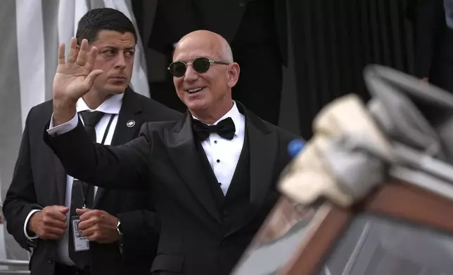 Jeff Bezos leaves a hotel ahead of the anticipated wedding celebrations with Lauren Sanchez, in Venice, Italy, Friday, June 27, 2025. (AP Photo/Antonio Calanni)