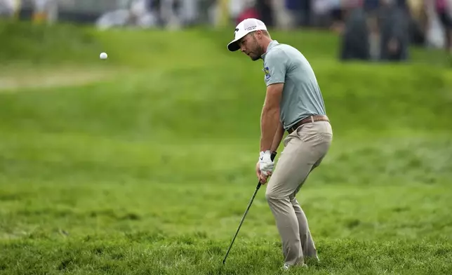 Sam Burns hits from the rough on the 11th hole during the final round of the U.S. Open golf tournament at Oakmont Country Club Sunday, June 15, 2025, in Oakmont, Pa. (AP Photo/Seth Wenig)