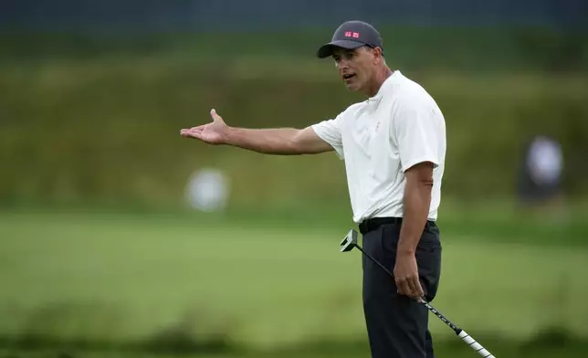 Adam Scott, of Australia, reacts after missing a putt on the 13th hole during the final round of the U.S. Open golf tournament at Oakmont Country Club Sunday, June 15, 2025, in Oakmont, Pa. (AP Photo/Charlie Riedel)
