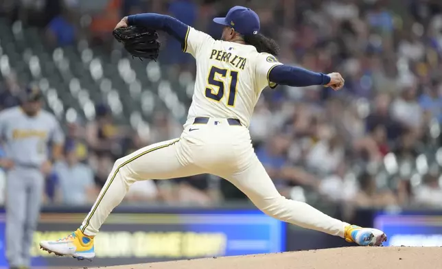 Milwaukee Brewers' Freddy Peralta pitches during the first inning of a baseball game against the Pittsburgh Pirates, Tuesday, June 24, 2025, in Milwaukee. (AP Photo/Aaron Gash)