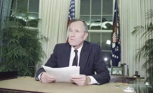 FILE - President George H.W. Bush addresses the nation on May 1, 1992, from the Oval Office in Washington. (AP Photo/Dennis Cook, File)