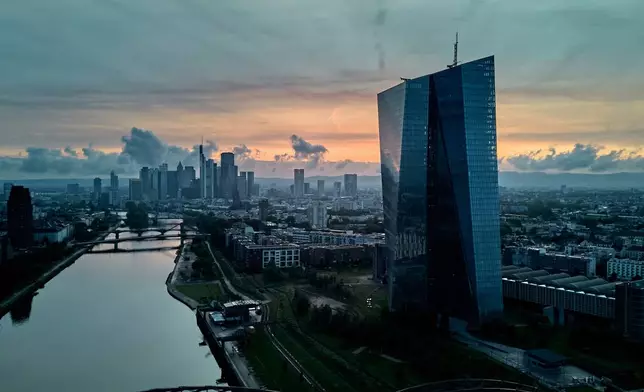 The European Central Bank, right, is pictured in Frankfurt, Germany, Wednesday, June 4, 2025. (AP Photo/Michael Probst)