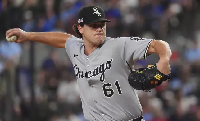 Chicago White Sox starting pitcher Mike Vasil throws during the first inning of a baseball game against the Texas Rangers, Saturday, June 14, 2025, in Arlington, Texas. (AP Photo/LM Otero)